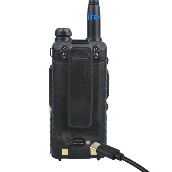 Black walkie-talkie with a USB cable on a white background
